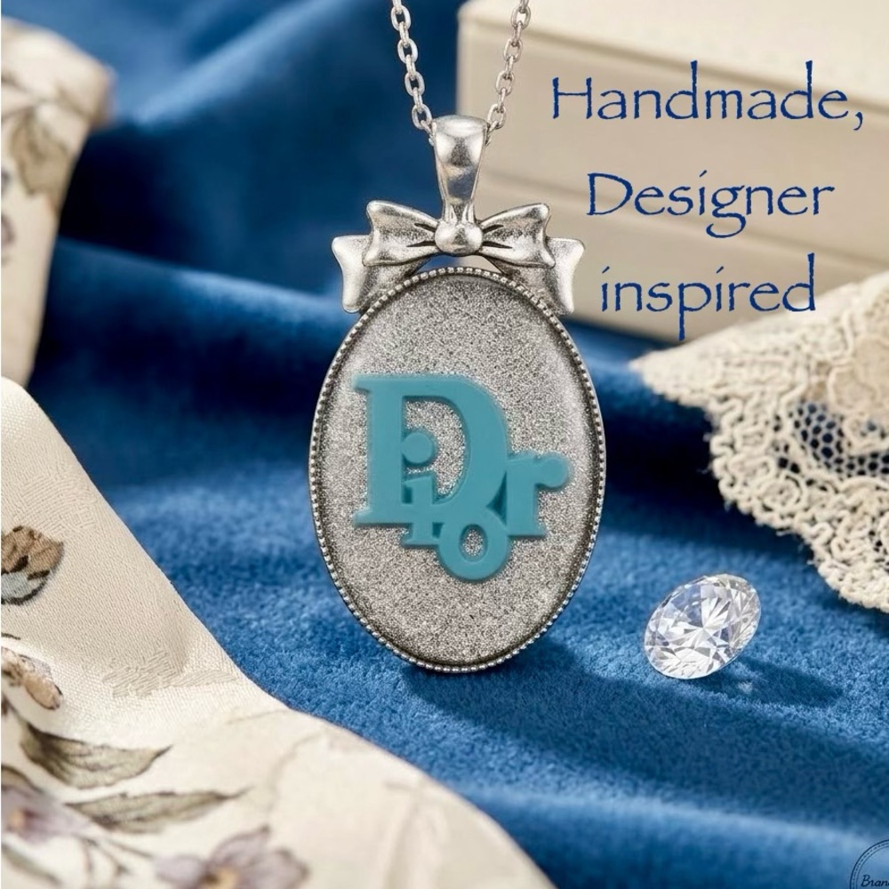 Handmade Designer-Inspired Medallion Pendant with bow:  Silver with Blue inlay.